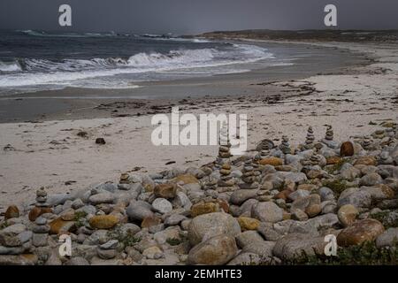 Towers of pebbles on Spanish Bay Beach, California Stock Photo