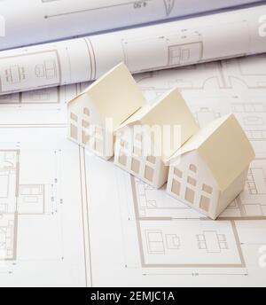 Real estate, construction blueprints concept. Residence complex architectural drawings and detached houses models on an office desk. Architect enginee Stock Photo