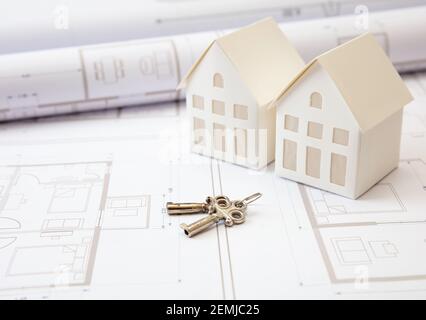 Construction design blueprints. Keys on housing plans, Real estete development project. Contractor, realtor work space Stock Photo