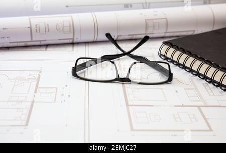 Project blueprints and architect engineer workplace. Real estate, housing project design, construction site office concept. Stock Photo