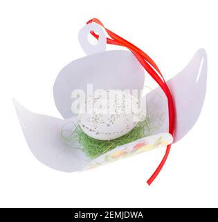 Easter hen's egg with carving in opened gift box. Macro. Isolated on a white background. Stock Photo