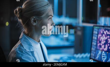 Medical Research Laboratory: Portrait of Female Scientist Working on Computer, Analysing DNA, Virus. Advanced Scientific Lab for Medicine Stock Photo