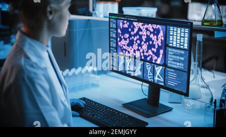 Medical Research Laboratory: Portrait of Female Scientist Working on Computer, Analysing DNA, Virus. Advanced Scientific Lab for Medicine Stock Photo