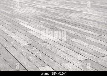 The surface with elongated rectangular stone tiles of gray color goes into diagonal perspective Stock Photo