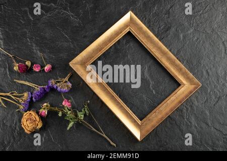 Dried flowers with frame on a black background Stock Photo