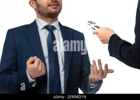 cropped view of anchorwoman interviewing businessman with dictaphone isolated on white Stock Photo