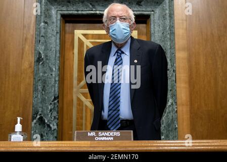 Washington, United States. 25th Feb, 2021. Senator Bernie Sanders, chairman of the Budget Committee, arrives to a U.S. Senate Budget Committee hearing r on Capitol Hill in Washington, Thursday, February. 25, 2021. The hearing is examining low wages at large profitable corporations. Pool Photo by Stafani Reynolds/UPI Credit: UPI/Alamy Live News Stock Photo