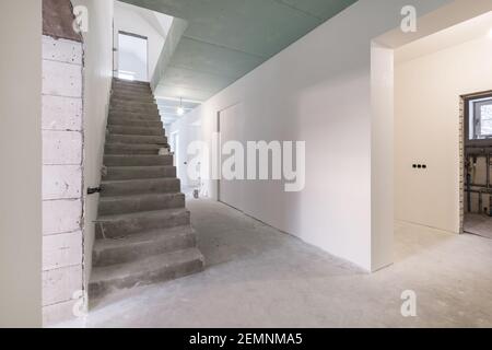 empty white room with concrete stair without repair and furniture Stock Photo