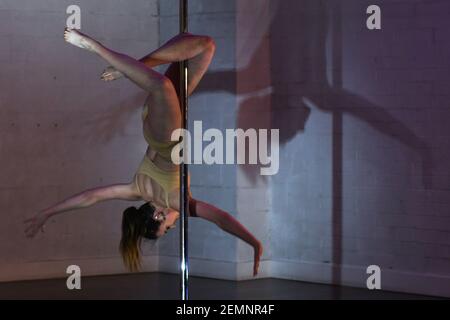 Megan O'Grady perfoms on the pole during the Tribe Showcase and Party 2019,  organised by Tribe Fitness & Dance Studio owned by Lisette Krol, three  times World Doubles Champion in Pole Dancing