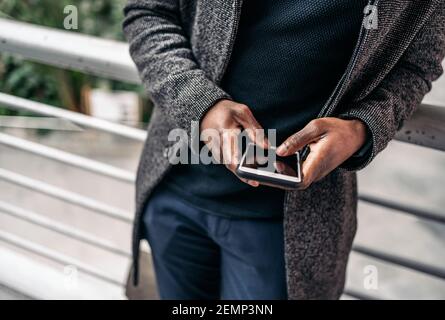 Anonymous Man Chatting On Phone Outdoors Stock Photo