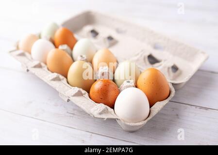 Fresh eggs from free range chickens on a small farm, beautiful colorful eggs from different breeds of chickens Stock Photo