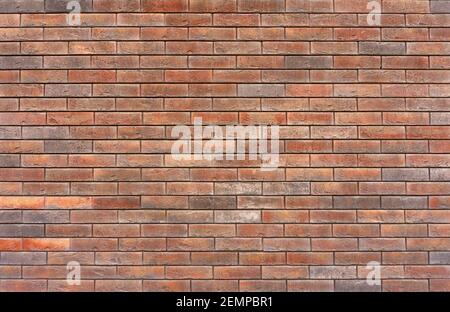 Old brick wall. Brickwork from an old brick in a rustic style. The structure and pattern of the destroyed stone wall. Copy space. . High quality photo Stock Photo