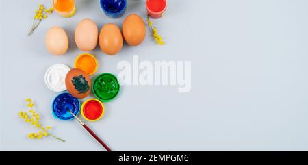 Eggs and paints. Easter eggs decoration process. Stock Photo