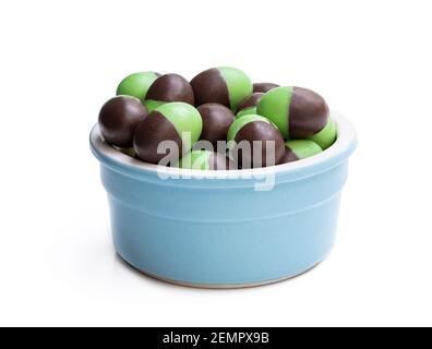 Peppermint  milk chocolate mini eggs in clay bowl isolated on white Stock Photo