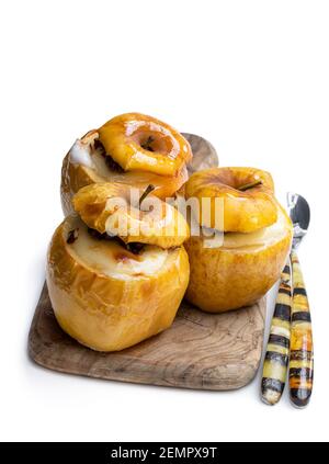 Baked  apples stuffed with soft cheese and nuts isolated on white Stock Photo