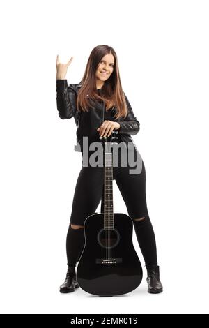 Rock musician with acoustic guitar gesturing a sign isolated on white background Stock Photo