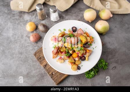 Roasted vegetables mix on a white plate ready to serve Stock Photo