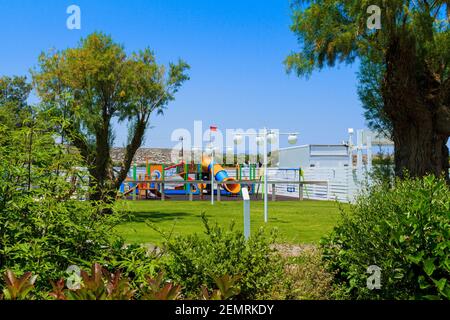 Children's wooden playground recreation area at public park Stock Photo