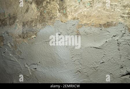 the texture of rough old cement plaster that has fallen off the wall. Stock Photo