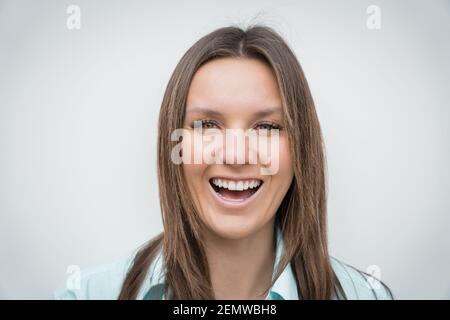Cheerful happy smiling woman with white perfect smile looking at the camera Stock Photo