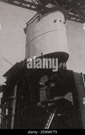 A printed photo of the Orient Line, 'Orcades'  Installing the funnel.  when under struction  by Vickers-Armstrong at Barrow in Furness yard no. 950. She was launched in 1947 and was used as a Royal Mail ship (RMS) and as passenger  and cruise vessel (S.S). She also carried many migrants to Australia and New Zealand. She also served as the accomodation ship for the 1956 Summer Olympics in Melbourne, Australia, Stock Photo