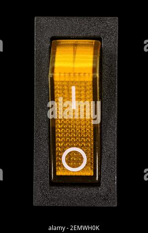 Yellow power switch at OF position, isolated on black background Stock Photo