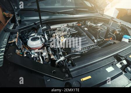 View under Car Hood of Modern turbocharged eco-friendly engine or motor. Stock Photo