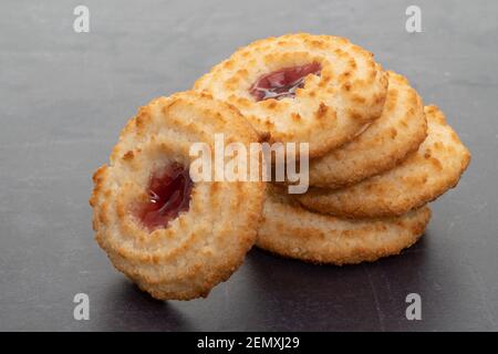 Coconut macaroons with a strawberry sauce filling Stock Photo