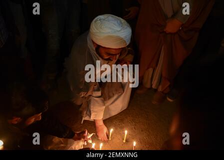  A Kashmiri Shia Muslim cleric seen lighting candles during a Protest in Srinagar. Shia protesters held a candle light vigil in Srinagar against the mass execution of 37 individuals in Saudi Arabia. According to Saudi Press Agency, those executed were accused of 'forming a terrorist cell' and attacking a security outpost, killing a number of officers. (Photo by Idrees Abbas / SOPA Images/Sipa USA) 