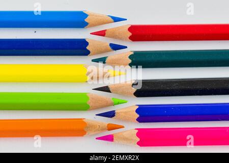 Different coloured colouring pencils arranged in lines Stock Photo
