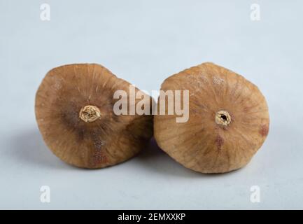 Two dried figs on white background Stock Photo