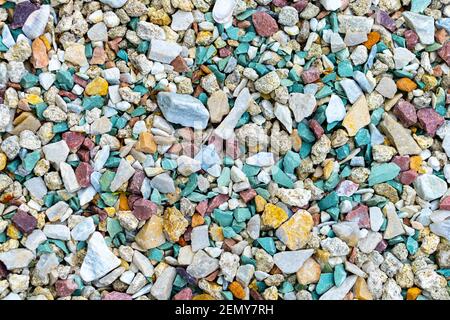 Sea pebbles. Pebble background. Wet stones. Multi-colored pebbles. Sea shore. Rocky texture from natural materials. Vacation, travel, building concept Stock Photo