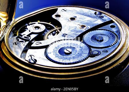 Gold pocket watch clockwork workings open case Stock Photo