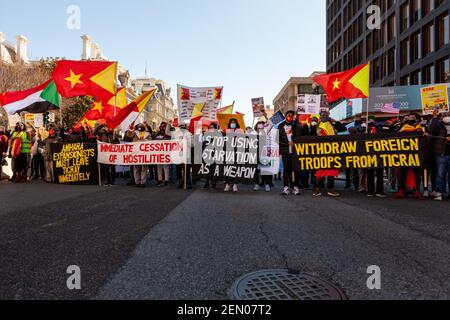 Washington, DC, USA, 25 February, 2021.  Pictured:  Ethiopians and their supporters carry banners, signs, and flags during a march in protest of the war Ethiopia is waging in Tigray.  They demand that the United States act to bring the war to an end.   Credit: Allison C Bailey/Alamy Live News Stock Photo