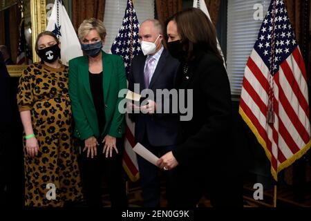 Washington, USA. 25th Feb, 2021. U.S. Secretary of Energy Jennifer Granholm (2nd L) with members of her family looks on after been sworn in by Vice President Kamala Harris (R) in the Eisenhower Executive Office Building at the White House in Washington on February 25, 2020. Photo by Yuri Gripas/Pool/Sipa USA Credit: Sipa USA/Alamy Live News Stock Photo