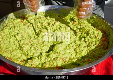 Making a big bowl of avocado guacamole Stock Photo - Alamy