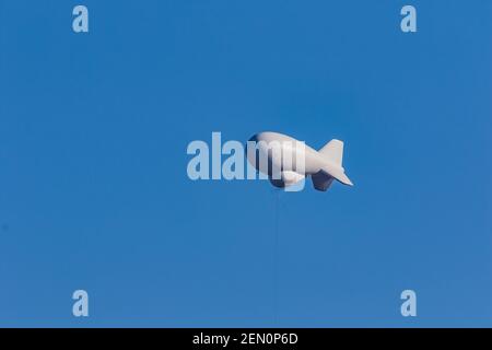Helium-filled tethered balloon at Fort Huachuca Aerostat Radar Site to catch airborne smugglers in Huachuca Mountains, Coronado National Forest, Arizo Stock Photo