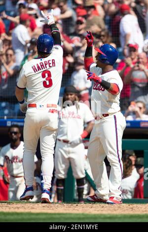 Bryce Harper and Jean Segura of the Philadelphia Phillies react