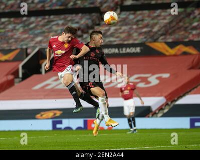 Manchester, UK. 26th Feb, 2021. Manchester United's Daniel James (L) sees his header saved during the UEFA Europa League Round of 32 second Leg football match between Manchester United and Real Sociedad in Manchester, Britain, on Feb. 25, 2021. Credit: Xinhua/Alamy Live News Stock Photo