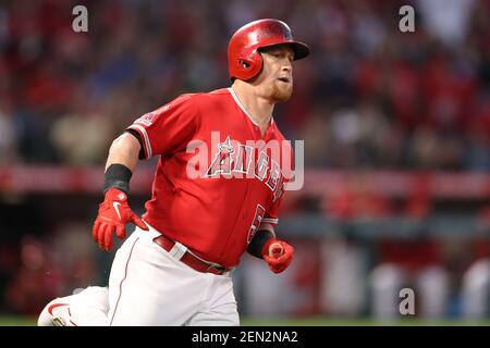 Texas Rangers right fielder Kole Calhoun throws during the second inning of  a spring training baseball game against the Seattle Mariners Monday, March  28, 2022, in Peoria, Ariz. (AP Photo/Charlie Riedel Stock