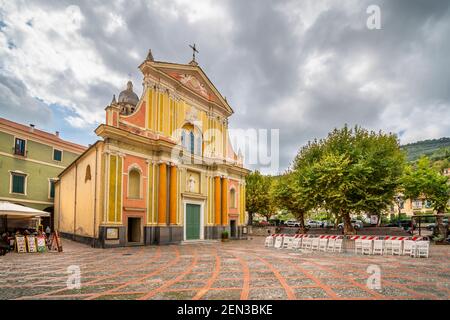 Front facade of he Sant Antonio Abate Church in a small piazza on an overcast day in Dolceacqua, Italy Stock Photo