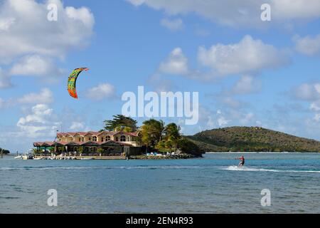 Kite surfing in front of Saba Rock, Virgin Gorda, British Virgin Islands Stock Photo