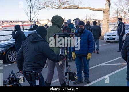 NEW YORK, NY – FEBRUARY 25: Crew and stand-ins rehearse for the filming of the television show 'Blue Bloods' season eleven in Astoria Park on February 25, 2021 in New York City. Credit: Ron Adar/Alamy Live News Stock Photo