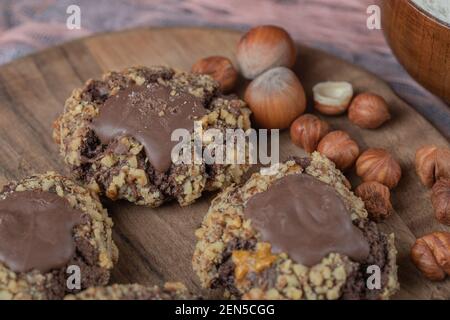 Chocolate nuts cookies on a wooden board Stock Photo
