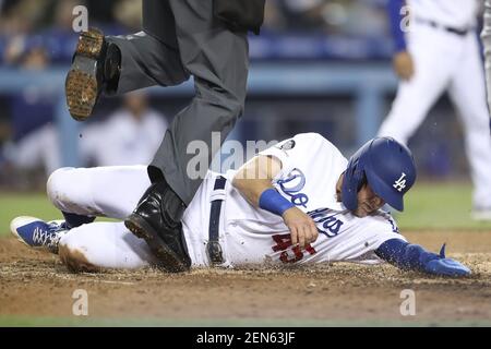 Matt Beaty of the Los Angeles Dodgers is covered by baby powder by