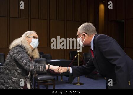 Washington, United States. 25th Feb, 2021. UNITED STATES - February 25: Rachel Levine fist bumps Sen. Richard Burr, R-N.C., at the end of her confirmation hearing to be Assistant Secretary, both of the Department of Health and Human Services before the Senate Health, Education, Labor, and Pensions committee in Washingto, DC, USA on Thursday, February 25, 2021.Photo by Caroline Brehman/Pool/ABACAPRESS.COM Credit: Abaca Press/Alamy Live News Stock Photo