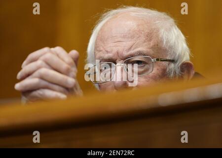 Washington, United States. 25th Feb, 2021. Senate Budget Committee Chairman Sen. Bernie Sanders, I-Vt., listens during a hearing on Capitol Hill in Washington, DC, USA, Thursday, February 25, 2021, examining wages at large profitable corporations. Photo by Susan Walsh/Pool/ABACAPRESS.COM Credit: Abaca Press/Alamy Live News Stock Photo