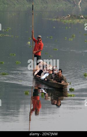 Early morning game-spotting excursion aboard a dug-out canoe on the Rapti River in Chitwan National Park on Nepal's southern border Stock Photo