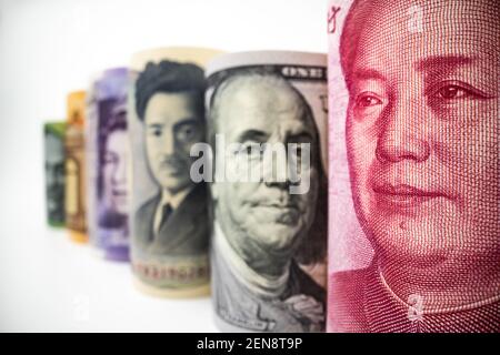 Macro shot of international currency money include US American Dollar, Euro Currency, British UK Pound, Australian Dollar, China Yuan and Japan Yen Stock Photo