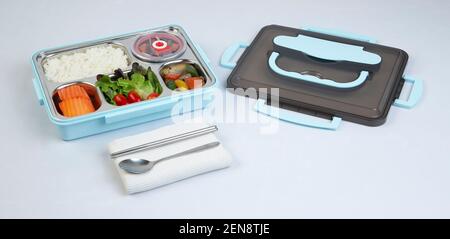 tiffin or lunch box with food isolated on white background Stock Photo